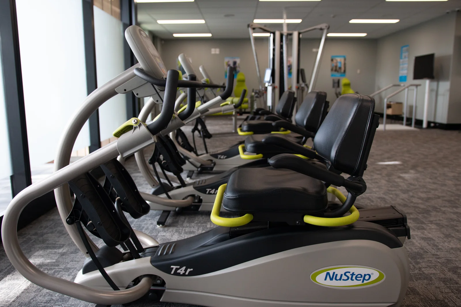 NuStep seated cross-trainers arranged in an exercise studio